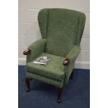 A MODERN HSL GREEN UPHOLSTERED WING BACK ARMCHAIR