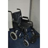 A WHEELTECH WHEELCHAIR with two foot rests