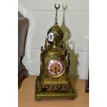 A TURKISH INSPIRED LATE 19TH CENTURY BRASS MANTEL CLOCK, of middle Eastern temple form, porcelain