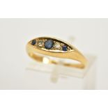 AN 18CT GOLD SAPPHIRE AND DIAMOND BOAT RING, set with three circular cut sapphires interspaced