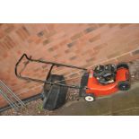 A CHAMPION CLASSIC 35 PETROL LAWN MOWER with a Briggs and Stratton engine and grass box (motor pulls