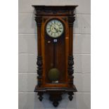 A LATE VICTORIAN WALNUT AND MAHOGANY VIENNA REGULATOR WALL CLOCK, the 6 1/2' dial with roman
