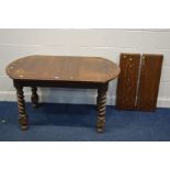 A SMALL EARLY 20TH CENTURY OAK BARLEY TWIST WIND OUT DINING TABLE with two additional leaves,