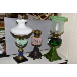 THREE LATE VICTORIAN OIL LAMPS, the tallest with green and frosted glass shade with green