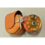 AN ARI 'T HART FLY FISHING REEL, gold coloured finish, (2 3/4'') in a tan leather pouch, the pouch