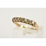 A 9CT GOLD HALF HOOP RING, designed with seven claw set, circular cut cubic zirconia, hallmarked 9ct