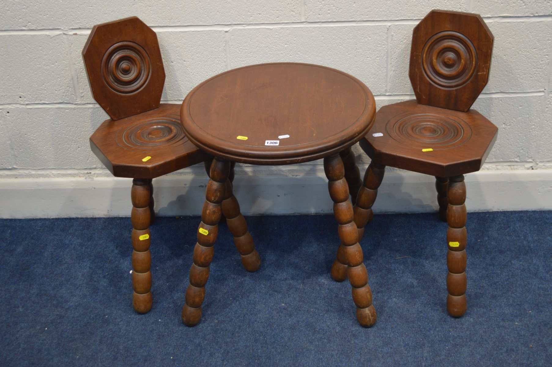 A PAIR OF MID TO LATE 20TH CENTURY MAHOGANY SPINNING CHAIRS together with a matching circular