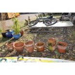 NINE TERRACOTTA PLANT POTS and a strawberry pot, the largest being 44cm in diameter (sd)