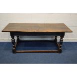 AN 18TH CENTURY OAK REFECTORY TABLE, a triple plank top, above a carved frieze, on turned and
