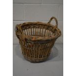 A VINTAGE WICKER BASKET, diameter 50cm x height 35cm