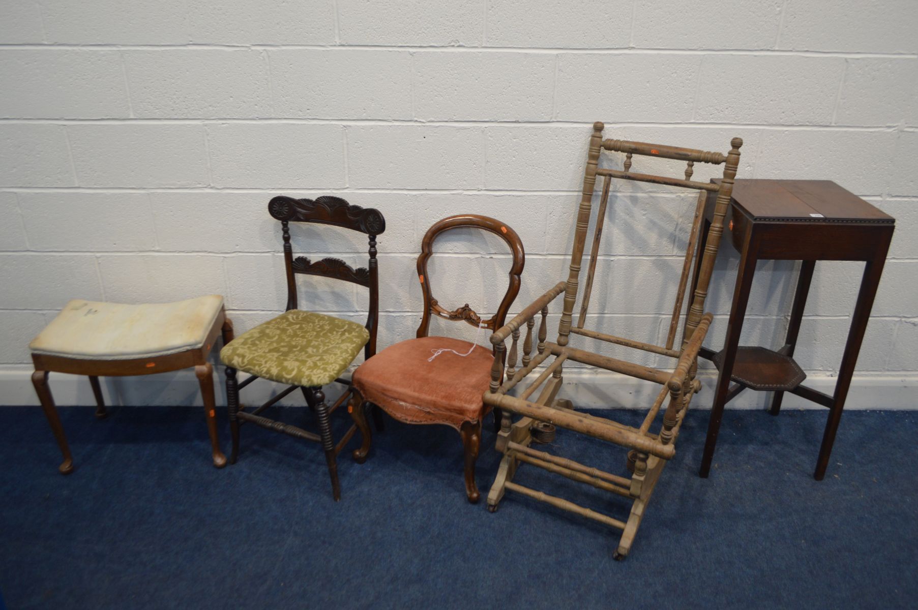 AN EARLY TO MID 20TH CENTURY OAK PLANT STAND, on a square tapering legs united by an undershelf,