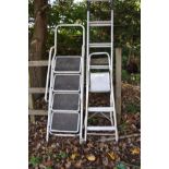 TWO ALUMINIUM STEP LADDERS and a painted steel step ladder the longest being 196cm in length (3)