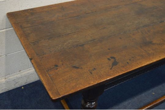 AN 18TH CENTURY OAK REFECTORY TABLE, a triple plank top, above a carved frieze, on turned and - Image 2 of 3