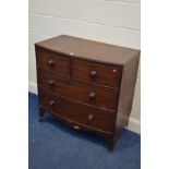 A GEORGIAN MAHOGANY BOWFRONT CHEST OF TWO SHORT OVER TWO LONG DRAWERS on tall bracket feet (