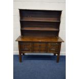 A MID TO LATE 20TH CENTURY OAK SIDEBOARD, with two central drawers with a matched dresser top, width