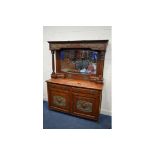 AN EARLY 20TH CENTURY WALNUT ARTS AND CRAFTS MIRROR BACK SIDEBOARD, the top with a bevelled edge