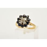A SAPPHIRE AND DIAMOND CLUSTER RING, the yellow metal cluster ring set with four round brilliant cut
