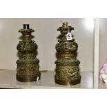 A PAIR OF FRENCH BRONZE GAGNEAU LAMPISTE CLOCKWORK OIL LAMP BASES, converted to electricity,