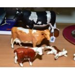 FOUR BESWICK CATTLE, comprising Friesian Bull ch 'Coddington Hilt Bar', on a wooden plinth No.