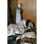 TWO NATIVITY LLADRO FIGURES, 'Donkey' No 4679 and 'Calfskin' No 4680 (tail chipped and reglued),