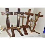 A COLLECTION OF THIRTEEN CRUCIFIXES, several with figures of Christ, assorted woods and material,