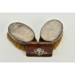 TWO SILVER BRUSHES AND A LEATHER PURSE,each brush of plain polished oval design, with engraved