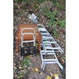 A MODERN TEAK GARDEN OCCASIONAL TABLE, a folding aluminium sack truck and two aluminium step ladders