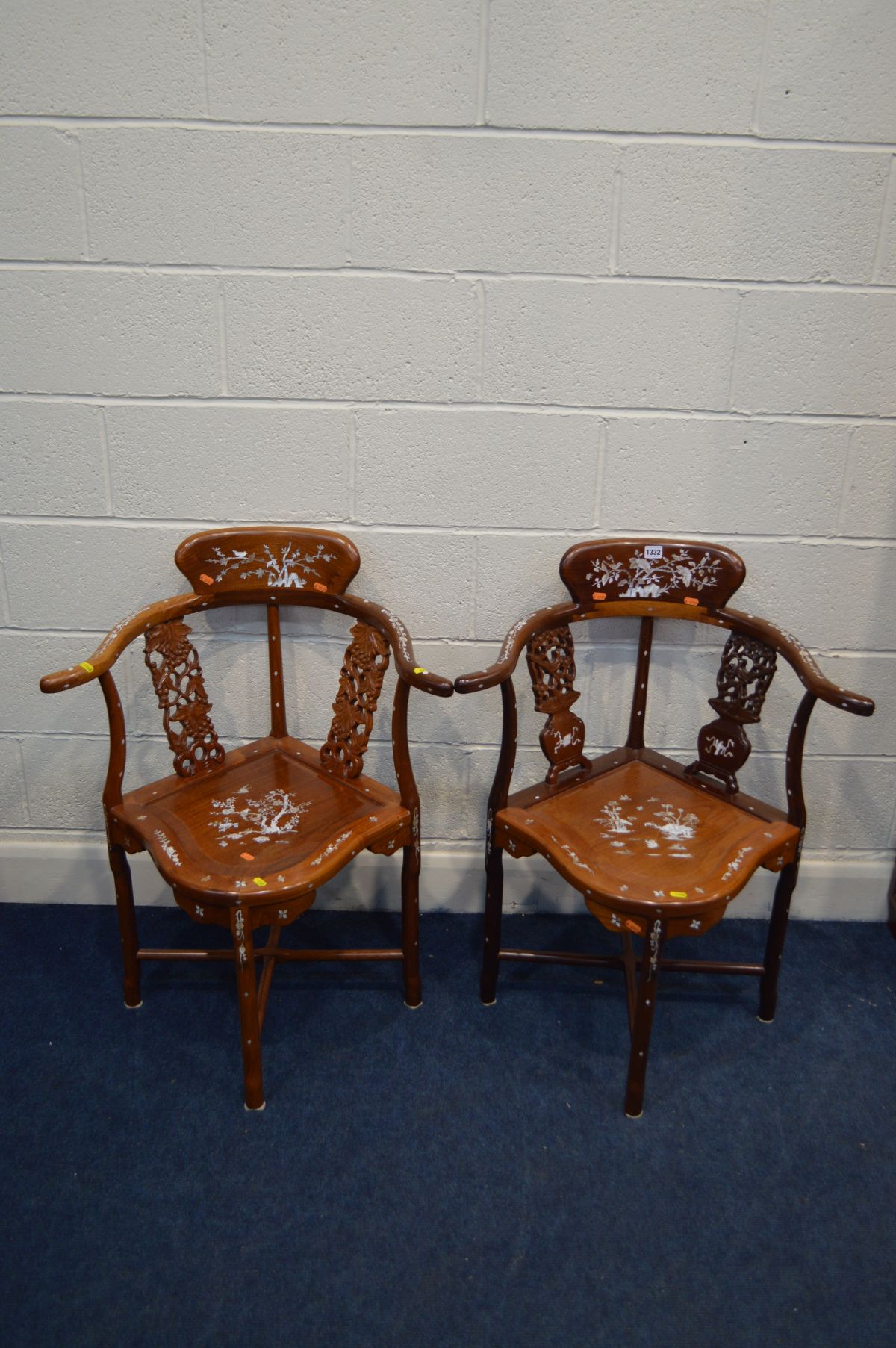 A NEAR PAIR OF MID TO LATE 20TH CENTURY ORIENTAL HARDWOOD CORNER CHAIRS, with mother of pearl