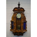 GISTAV BECKER, A LATE VICTORIAN WALNUT VIENNA WALL CLOCK, the glass door enclosing an enamel 6 1/2