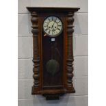 A LATE VICTORIAN WALNUT VIENNA WALL CLOCK, height 94cm (sd and losses) (winding key and pendulum)