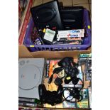 TWO TRAYS, containing Sony Playstation. two controllers and games, two Sega/Mega Drive II machines