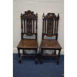 TWO EARLY 20TH CENTURY CARVED OAK HALL CHAIRS