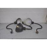 THREE EARLY TO MID 20TH CENTURY WALL/PICTURE LIGHTS with copper domed shades and swan neck stems and