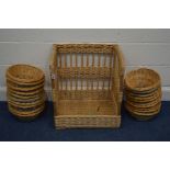 AN OBLONG WICKER BASKET with an open front, together with twenty proofing baskets, etc (22)