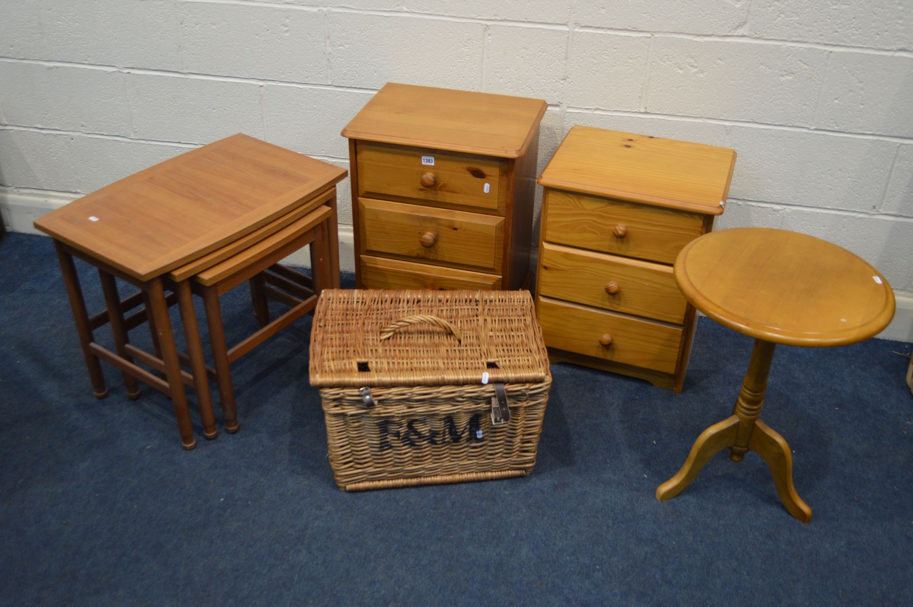 A NEAR PAIR OF PINE THREE DRAWER BEDSIDE CABINETS, a modern teak nest of three tables, oak