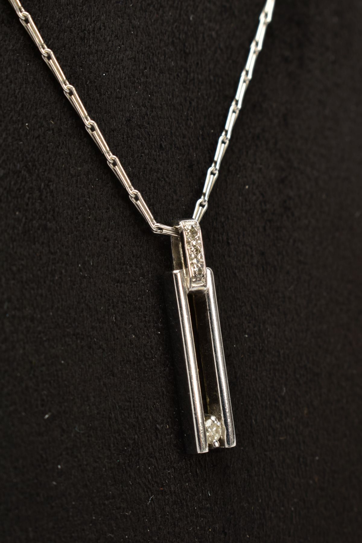 A 9CT WHITE GOLD DIAMOND PENDANT NECKLACE, the open work rectangular pendant, set with a single - Image 2 of 3