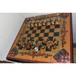 A MODERN WOODEN AND METAL CHESS SET, the board set into a storage base, height of King 10cm,