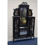 AN EDWARDIAN EBONISED VITRINE, with various shaped mirrors, single drawer, flanked with two glazed