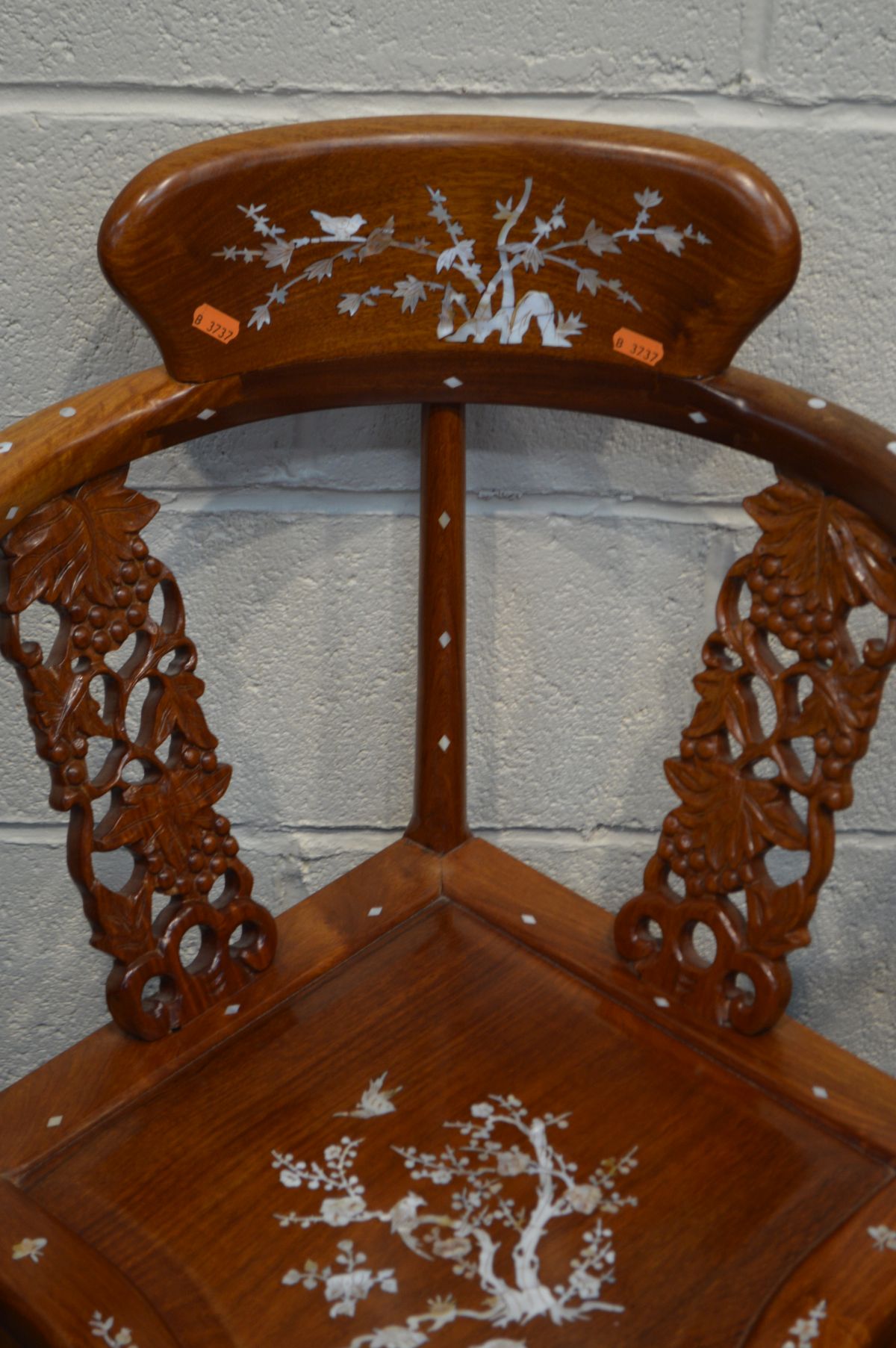 A NEAR PAIR OF MID TO LATE 20TH CENTURY ORIENTAL HARDWOOD CORNER CHAIRS, with mother of pearl - Image 6 of 7