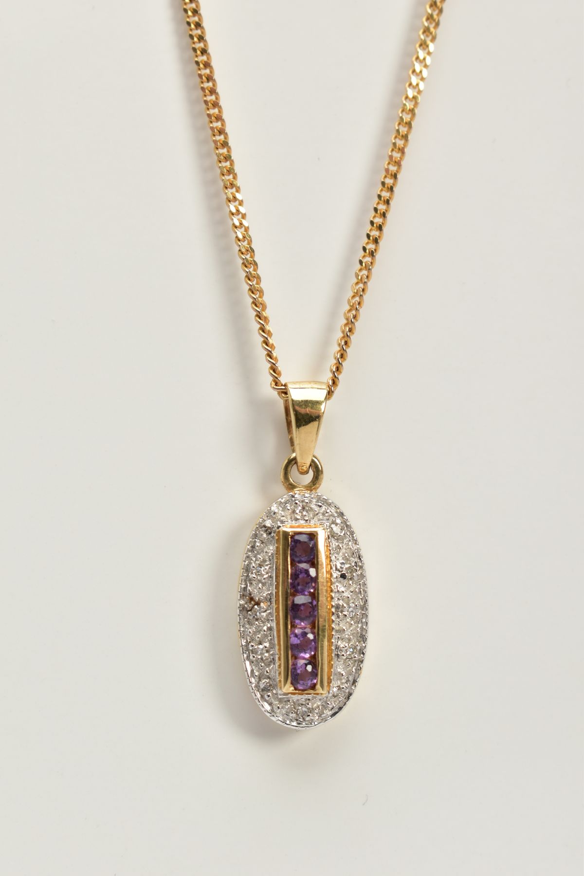 A 9CT GOLD AMETHYST AND DIAMOND PENDANT NECKLACE, the oval pendant designed with a central row of - Image 3 of 3