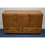 AN ERCOL BLONDE ELM MODEL 468 SIDEBOARD with triple doors revealing two sections and single