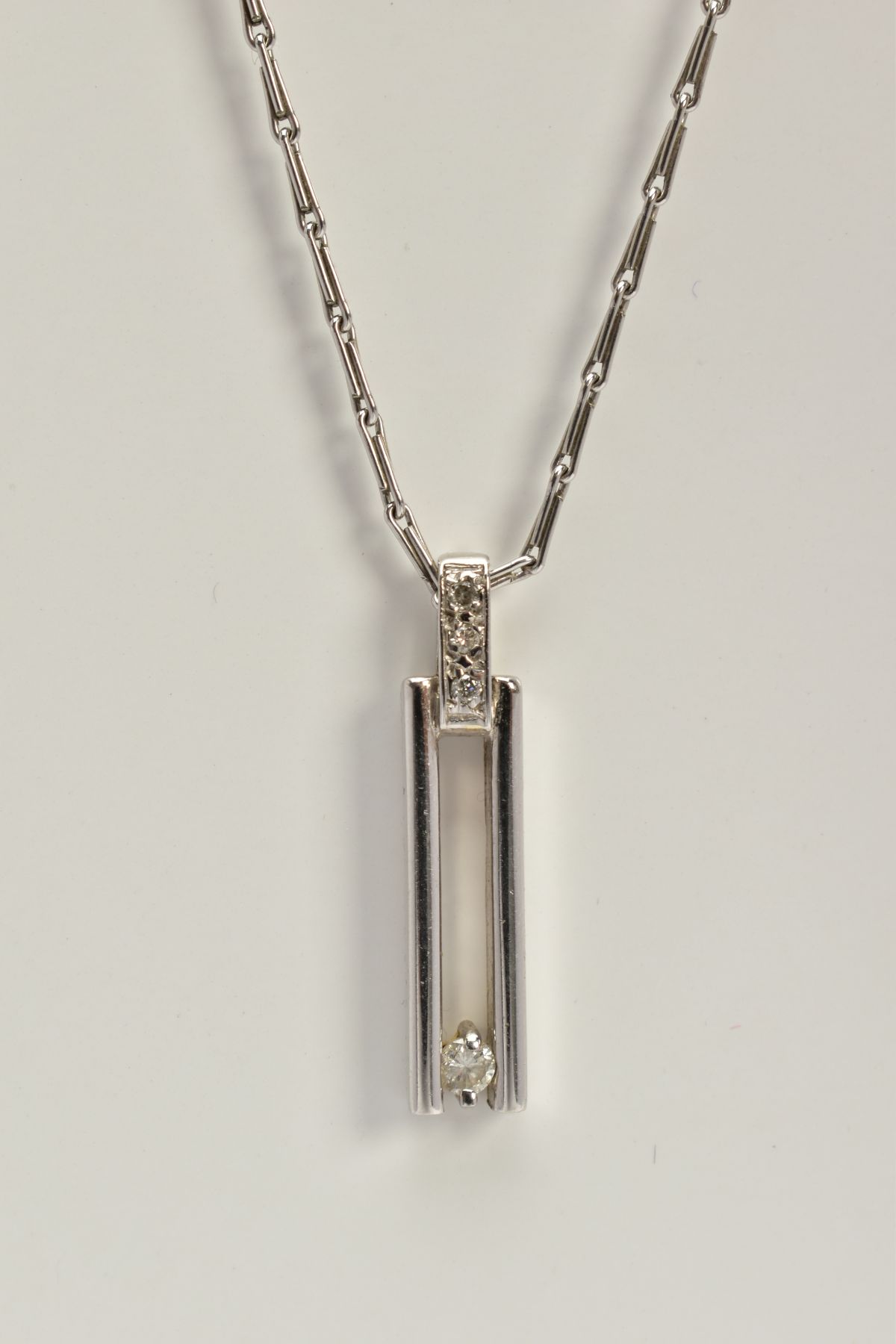 A 9CT WHITE GOLD DIAMOND PENDANT NECKLACE, the open work rectangular pendant, set with a single - Image 3 of 3