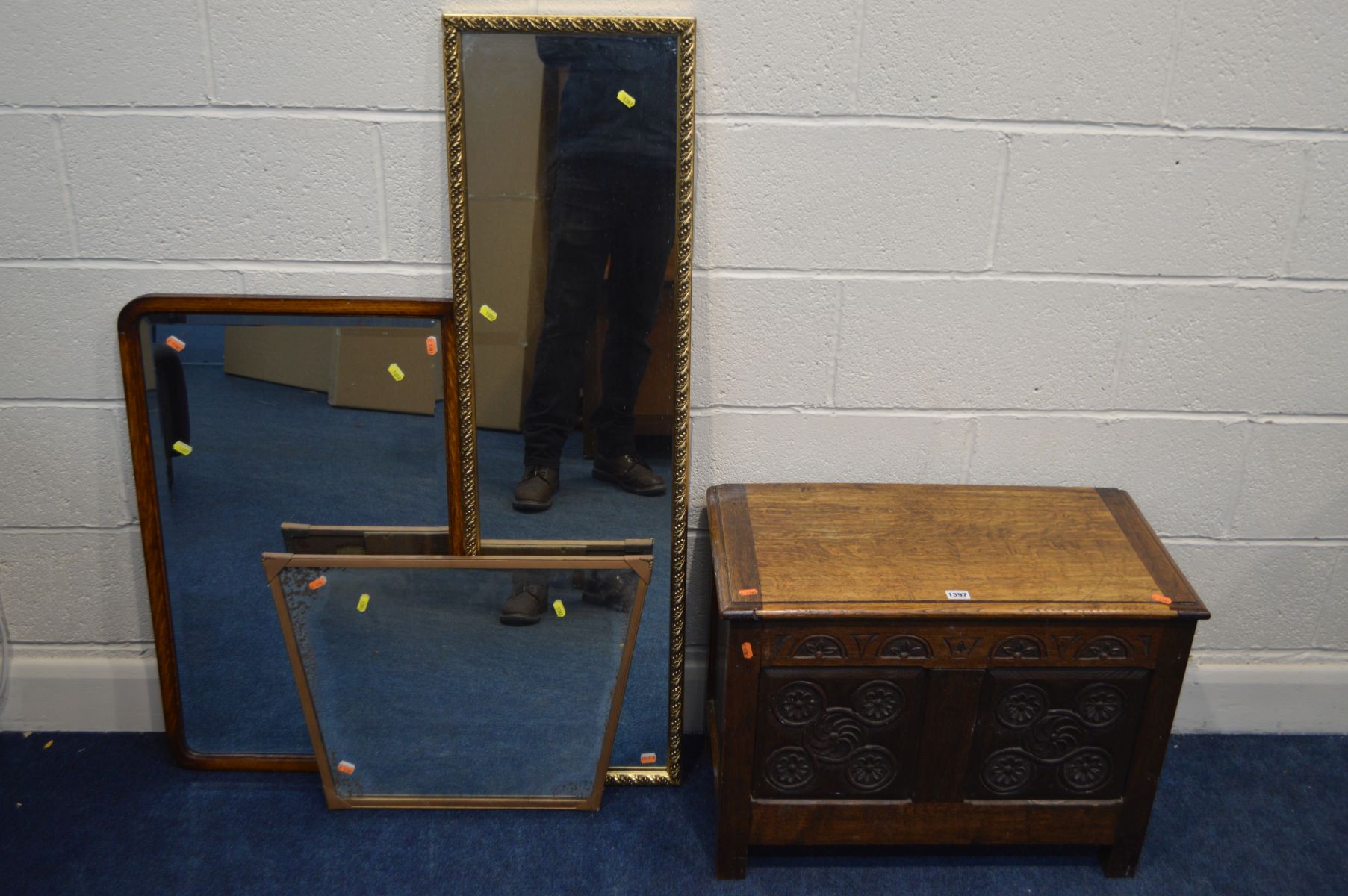 AN EARLY TO MID 20TH CENTURY OAK BLANKET CHEST, with lunette frieze above triple panel with