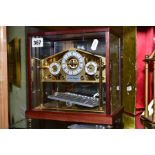 A LATE 20TH CENTURY GILT CONGREVE ROLLING BALL PLATFORM CLOCK, the main dial flanked by two