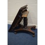 A DISTRESSED VICTORIAN MAHOGANY FOLD OVER TEA TABLE on a carved turned base and triform base,