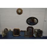 AN EARLY TO MID 20TH CENTURY OAK OVAL BEVELLED EDGE WALL MIRROR, with brass mounts, together with