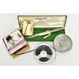 A BOXED REPLICA OF A WWII FAIRBURN SYKES COMMANDO DAGGER, by Wilkinson Sword, an alloy ash tray