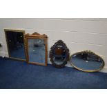 A MODERN GILT FRAMED OVAL WALL MIRROR, together with a carved ebonised wood wall mirror and two