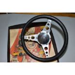 AN ASTRALI THREE SPOKE LEATHER RIMMED DISHED STEERING WHEEL, diameter approximately 13'' (34cm),