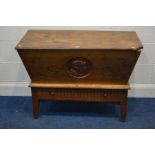 A 19TH CENTURY FRENCH WALNUT DOUGH TROUGH, carved front with a male face, on a base with a single